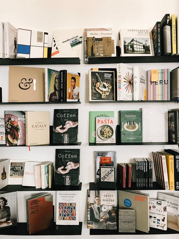 A beautifully curated bookshelf displaying a diverse collection of books in a modern library setting.